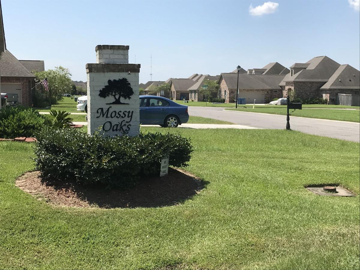 Dispute over collapsing backyards along Mossy Oaks neighborhood pond