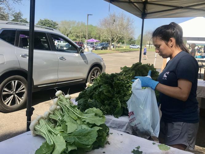 Customers flock to drivethru farmers market in Baton Rouge for local