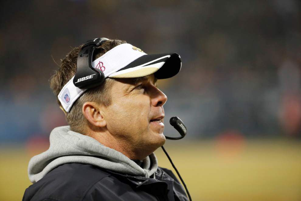 New Orleans Saints head coach Sean Payton (R) watches a replay on the  jumbotron at the Mercedes-Benz Superdome during play against the Baltimore  Ravens in New Orleans September 1, 2016. Photo by