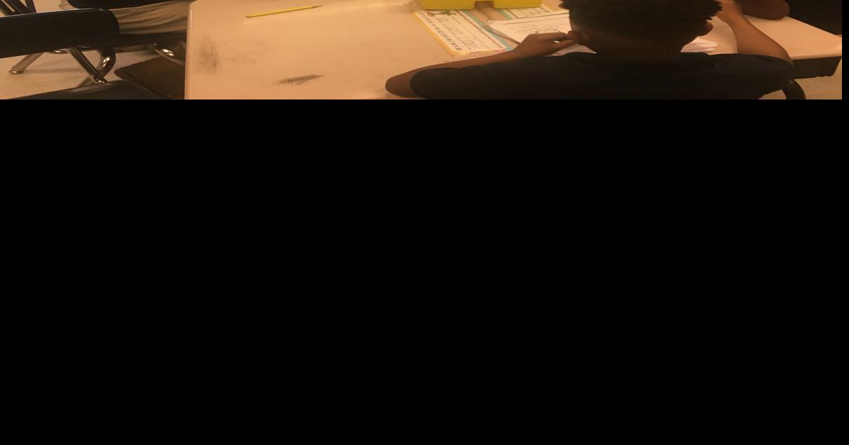 Donaldsonville football players read to elementary school children