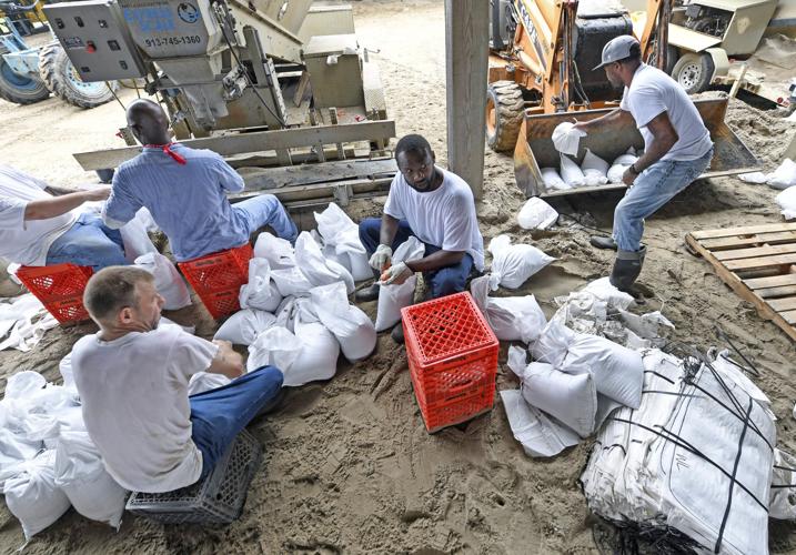 Prison trusties in St. Gabriel fill sandbags, give back to community in
