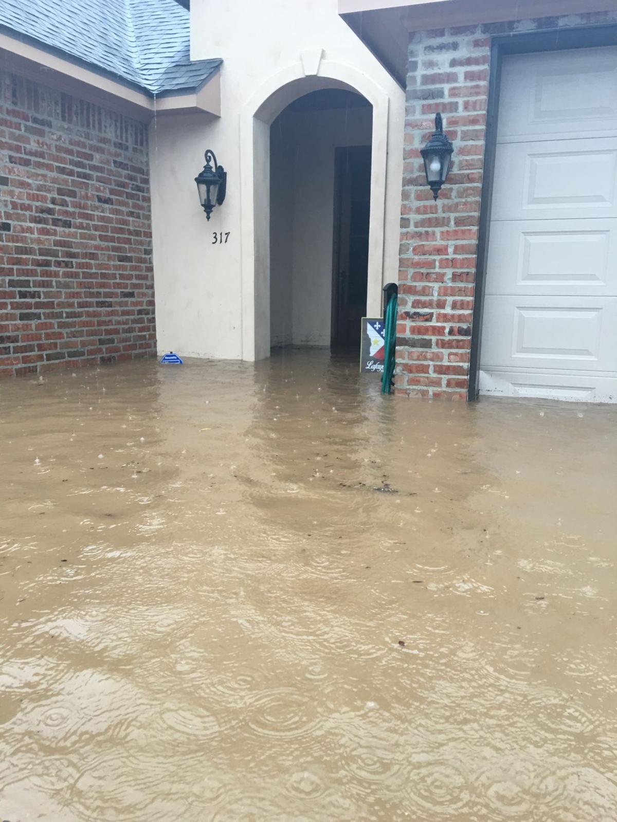 Hundreds evacuated, thousands stranded amid flooded roads as torrential downpours continue falling over Acadiana