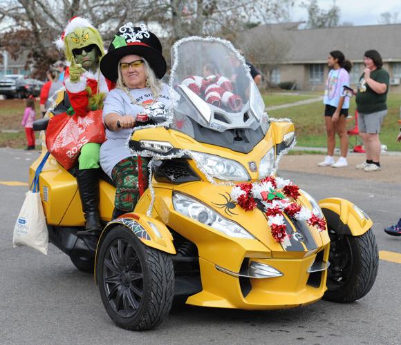 Dark clouds, rain can't stop Walker Christmas parade from rolling