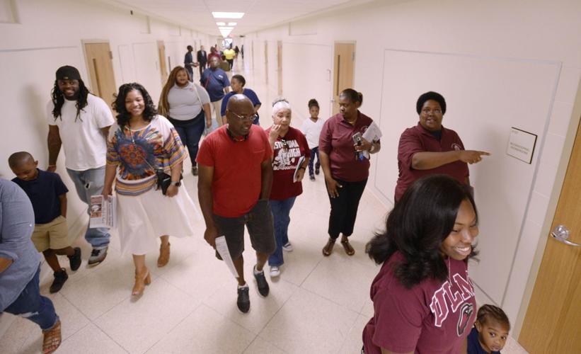 All smiles as alumni, faculty and students formally celebrate reopening