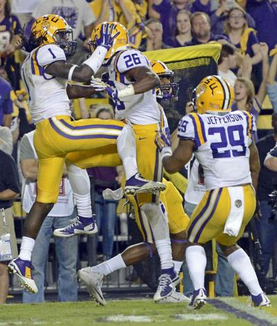 Photos: Wild, wacky, emotional game day ends with victory, LSU coach Les Miles carried off field by players _lowres