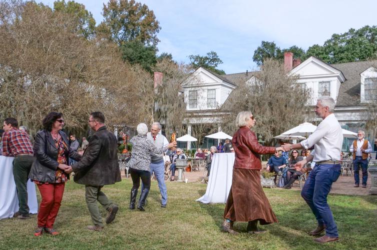 St. Francisville Food and Wine Festival visitors dance, dine, during