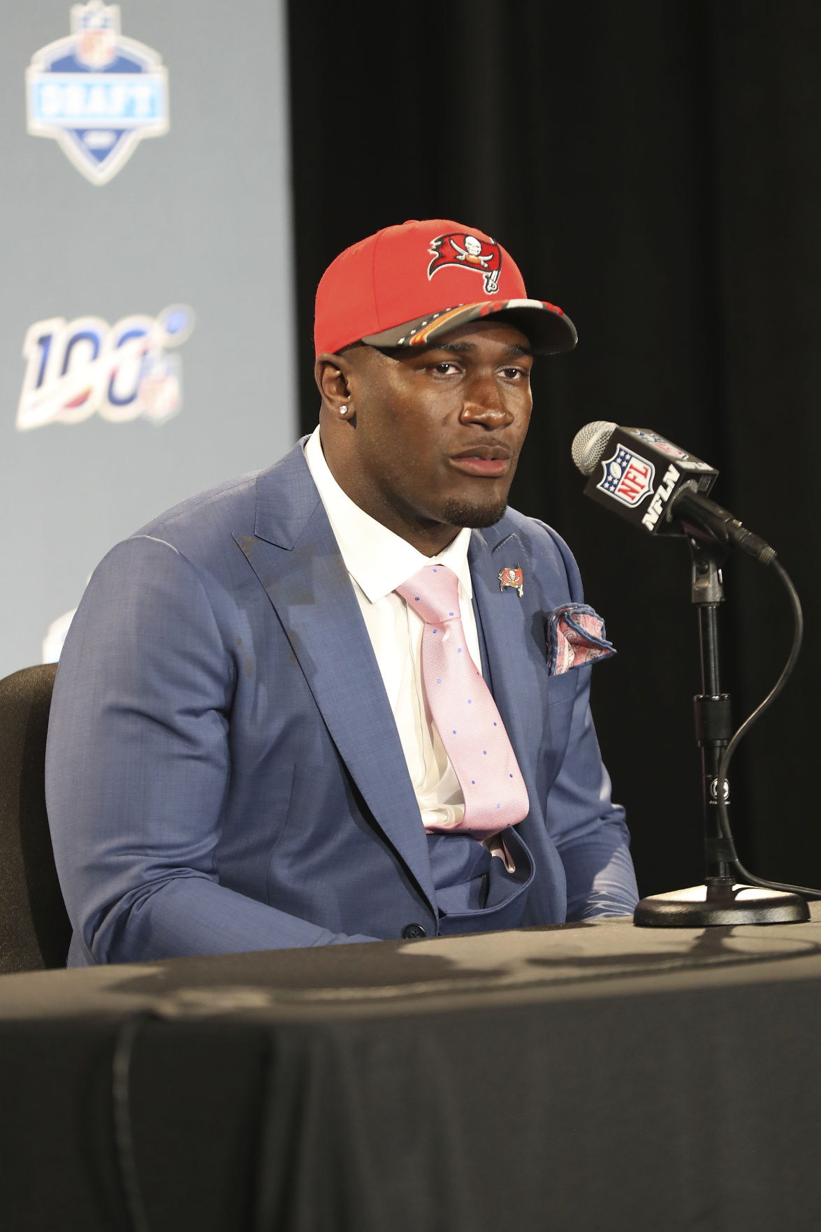 Louisiana State linebacker Devin White poses with his new teams jersey  after the Tampa Bay Buccaneers selected White in the first round at the NFL  football draft, Thursday, April 25, 2019, in