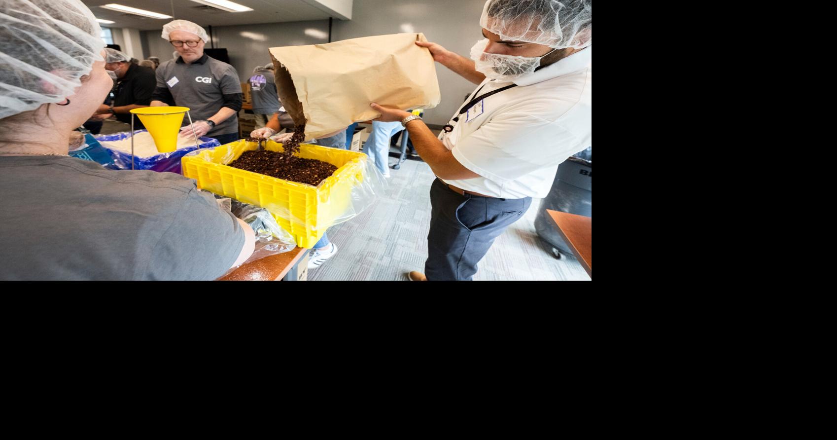 Photos: CGI volunteers 'Feed the Funnel' to pack 20k meals