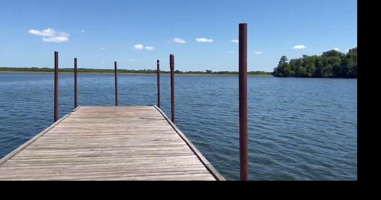 Walking along the pier at Cotile Lake Recreation Area's boat launch