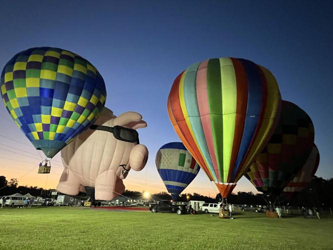 Pigasus and other balloons glow over Boucherie and Balloon Festival