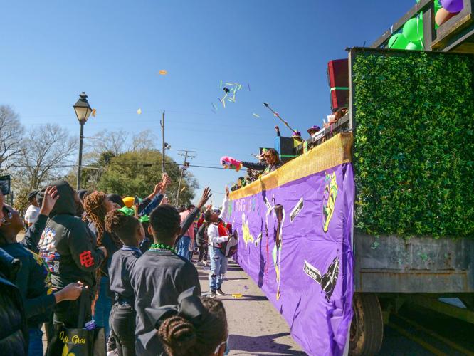 Carnival returns to Clinton as Mardi Gras parade rolls through town