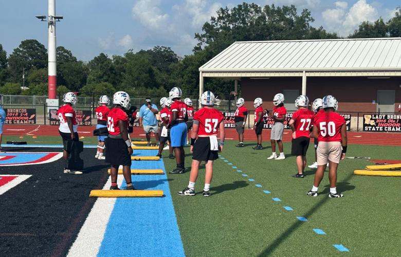 zac Coach Davis works with the offensive line on technique.jpg