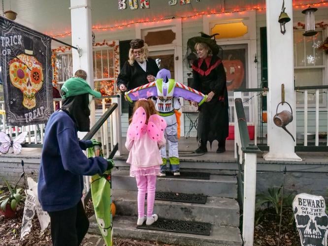 Costumed residents take to the streets of St. Francisville St