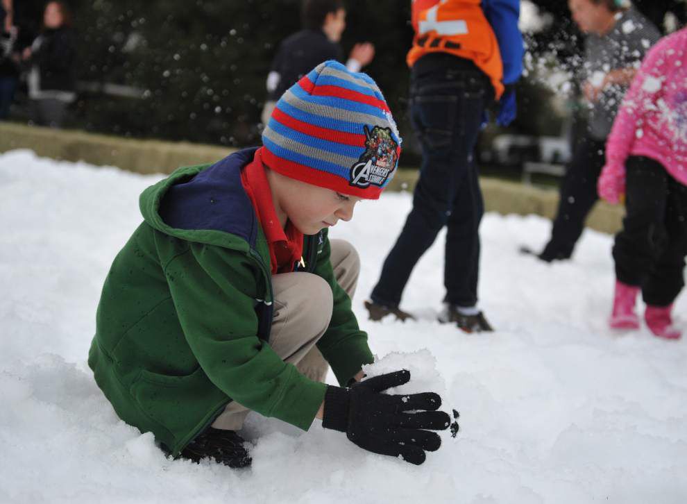 Photos: With some man-made help, annual Sneaux Day sees ice skating, snowballs _lowres