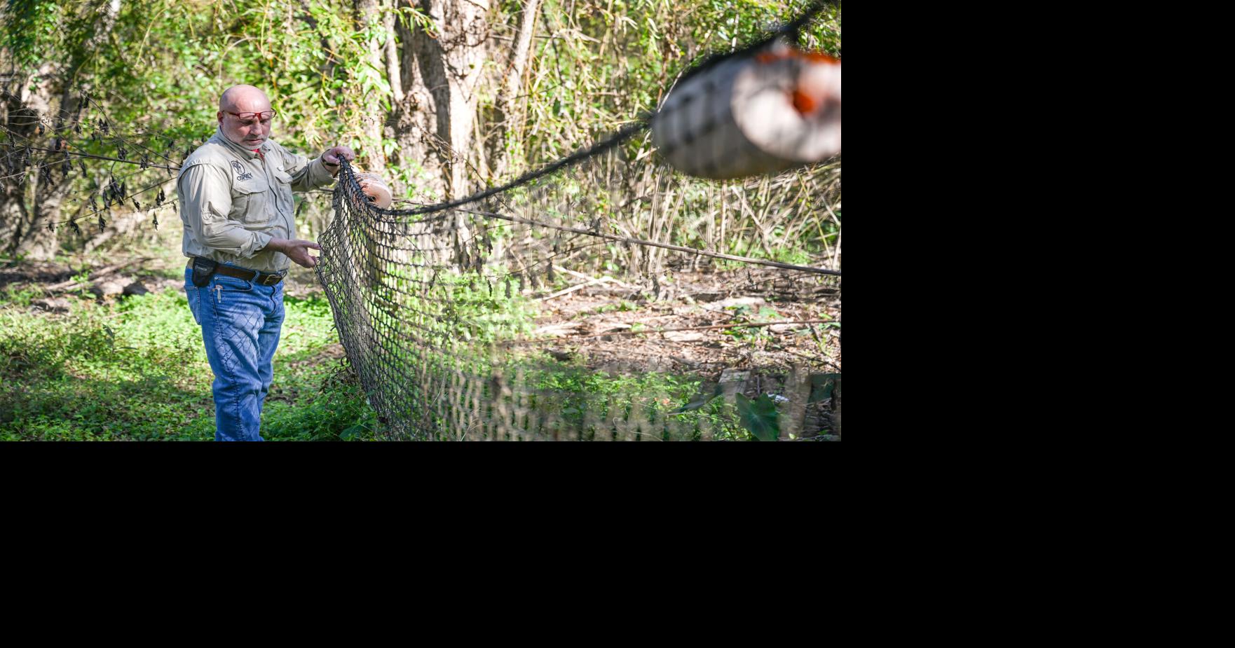 Meet the company that traps trash in Louisiana bayous, 'We get dirty.'