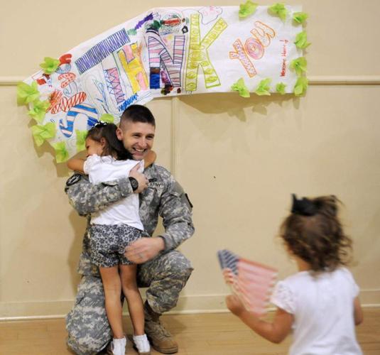 Returning Soldier Surprises Daughters At Preschool Zachary