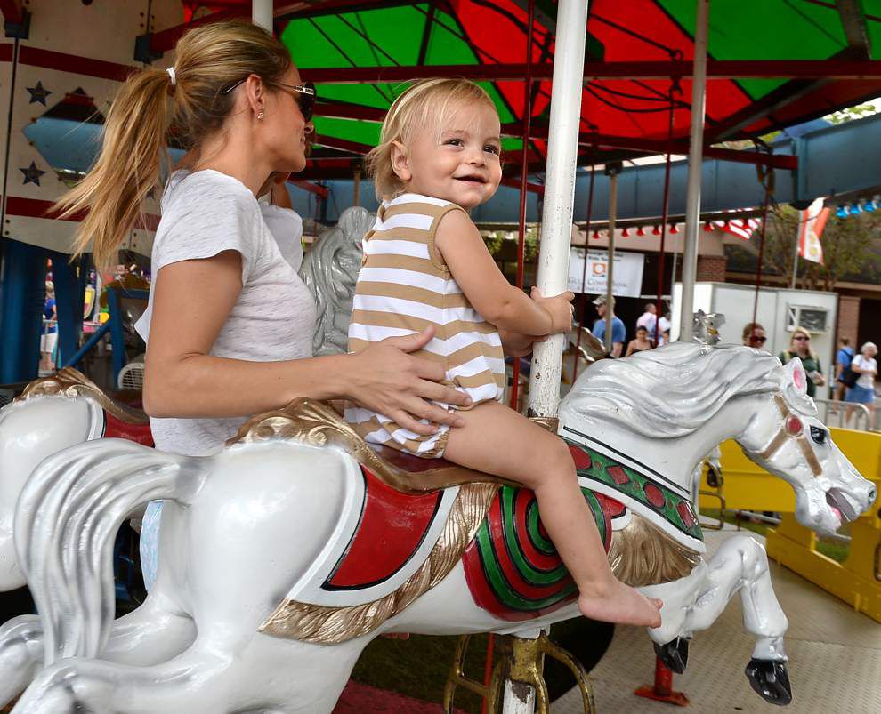 Flying horses, sliding dads, rolling dragons at St. George Fair _lowres