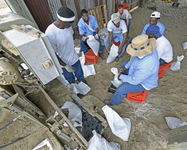 Prison trusties in St. Gabriel fill sandbags, give back to community in