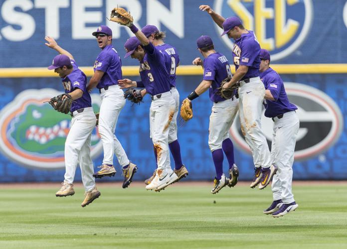 LSU's Greg Deichmann (7) is tagged out by Arkansas short stop Jax