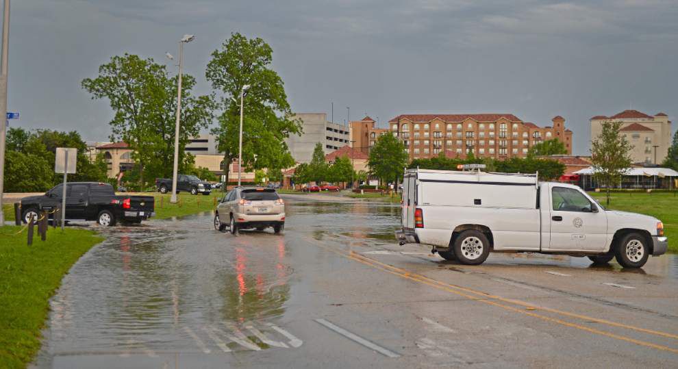 Traffic navigates a flooded Burbank Drive near LSU’s campus _lowres