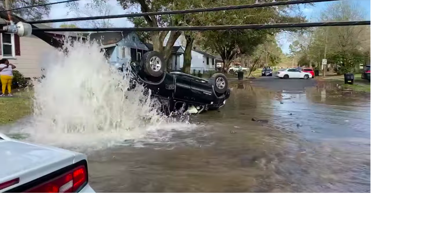 Video: Busted fire hydrant floods street after car crashed, flipped on ...