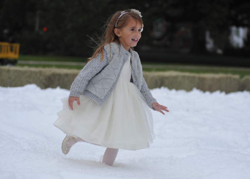 Photos: With some man-made help, annual Sneaux Day sees ice skating, snowballs _lowres