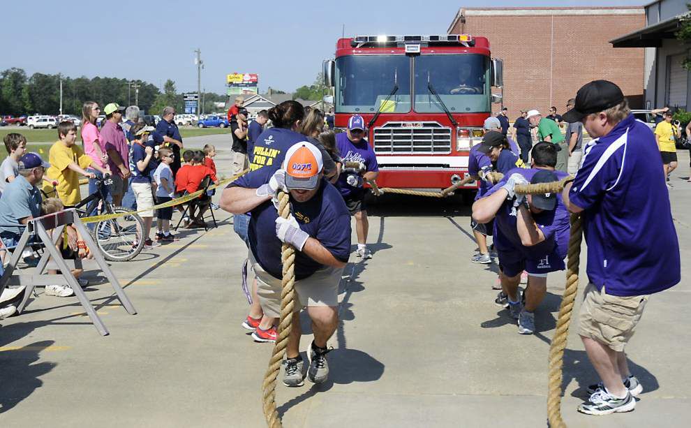 Teams pull fire trucks for Special Olympics _lowres