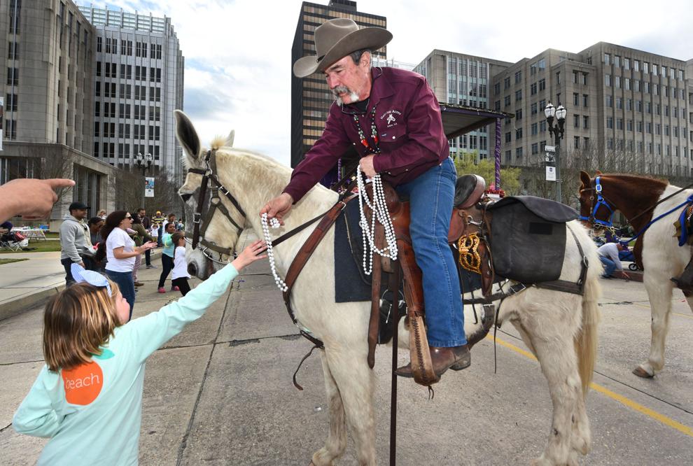 Photos & Video Krewe Mystique de la Capitale Mardi Gras parade rolls