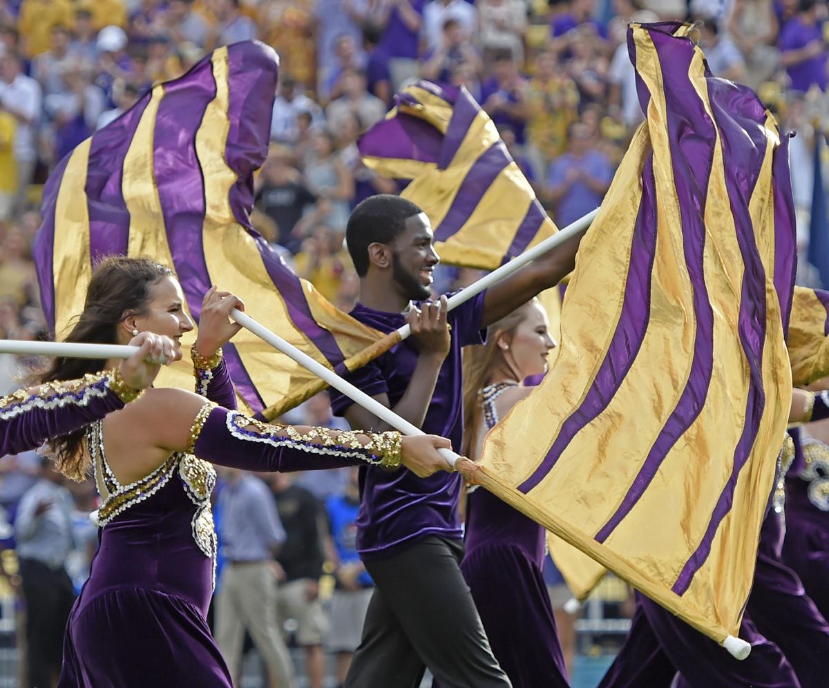 Believed to be first, City man dances, twirls flag with LSU
