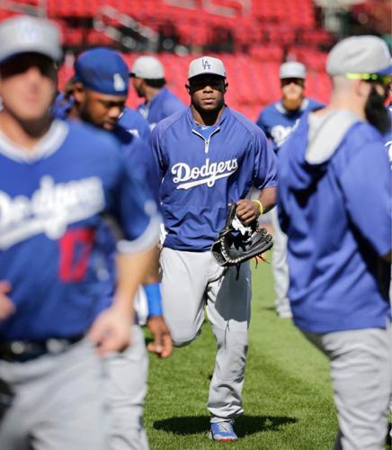 Los Angeles Dodgers' Yasiel Puig, center, Andre Ethier, right, and