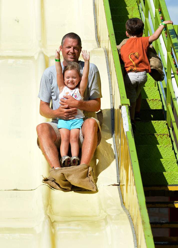 Flying horses, sliding dads, rolling dragons at St. George Fair _lowres