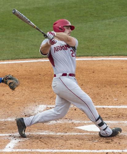 LSU's Greg Deichmann (7) is tagged out by Arkansas short stop Jax