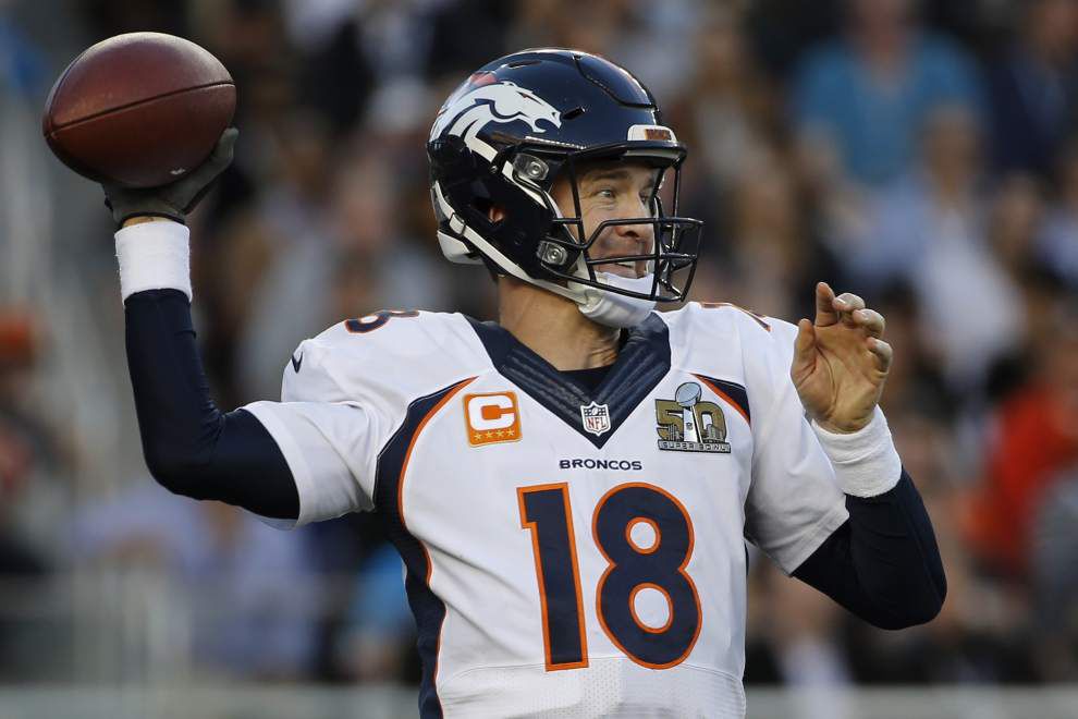 Denver Broncos tight end Owen Daniels and quarterback Peyton Manning  celebrate C.J. Anderson's two yard touchdown against the Carolina Panthers  in the fourth quarter of Super Bowl 50 in Santa Clara, California