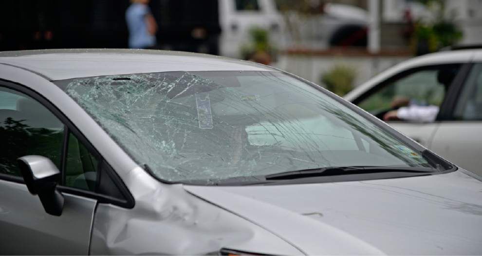Video, photos: Car strikes woman on bicycle Tuesday on Stanford Avenue _lowres