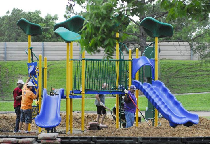 Thanks to efforts of dozens of volunteers, a new playground rises up at