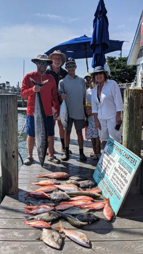 2021 charter fishing trip on dock.jpg