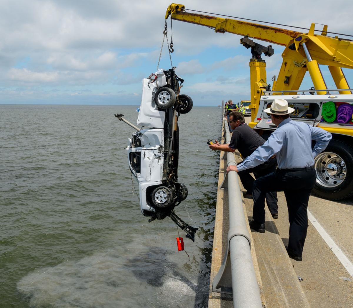 Causeway driver rescued after vehicle plunges into lake ...