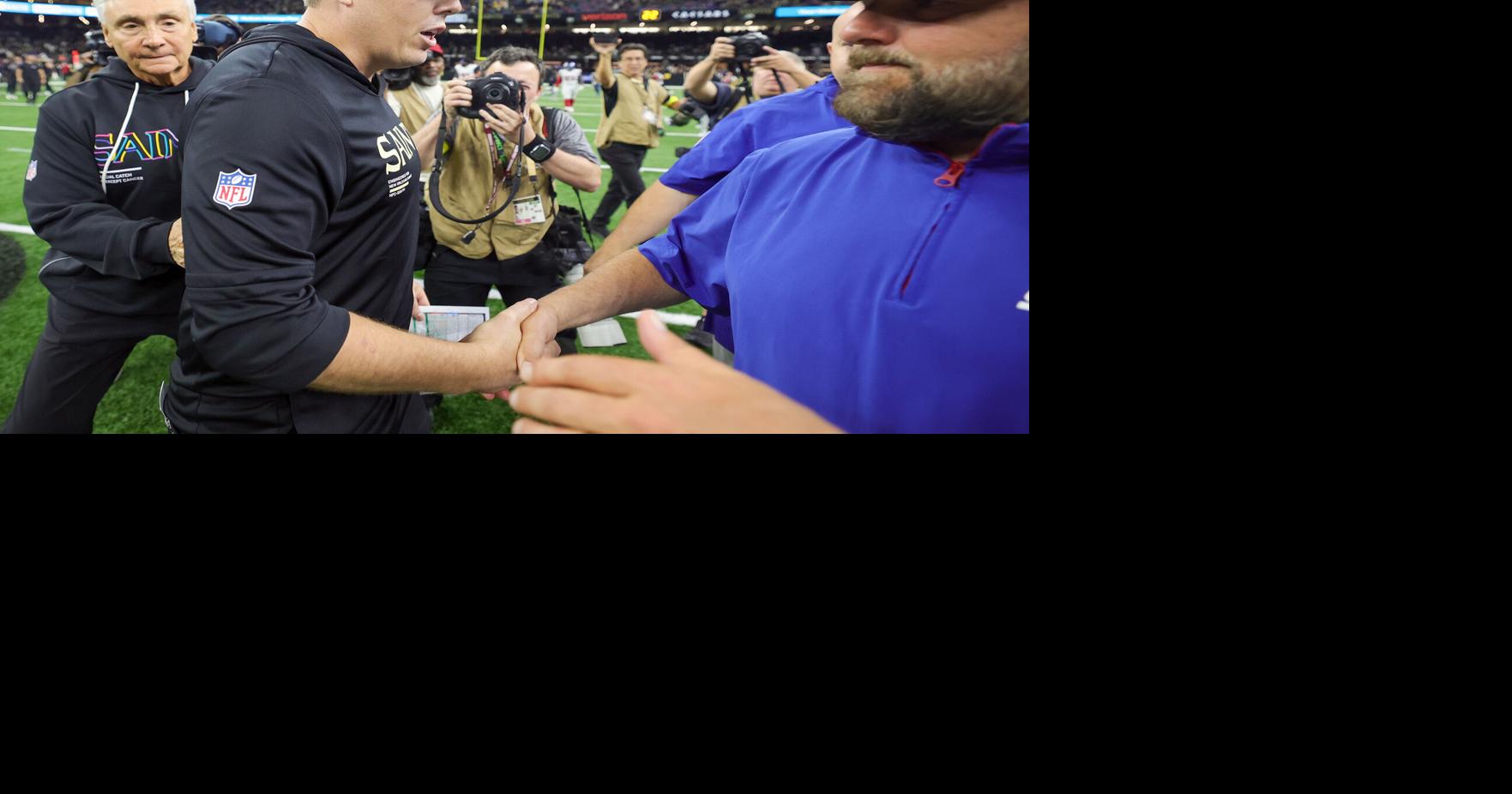 The scene inside the Saints locker room as Kellen Moore received the game ...