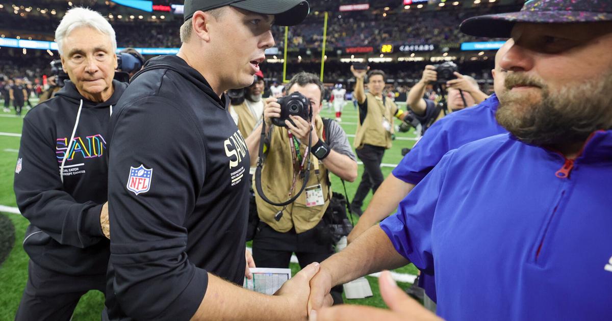The scene inside the Saints locker room as Kellen Moore received the game ...