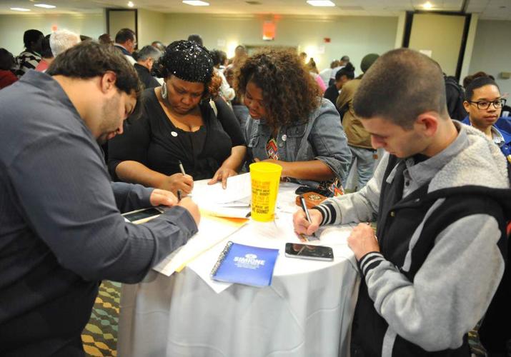Hundreds crowd Lafayette hotel to interview for jobs at Ambassador Town