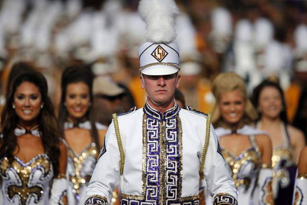 LSU Tiger Marching Band drum major waves goodbye to eventful season