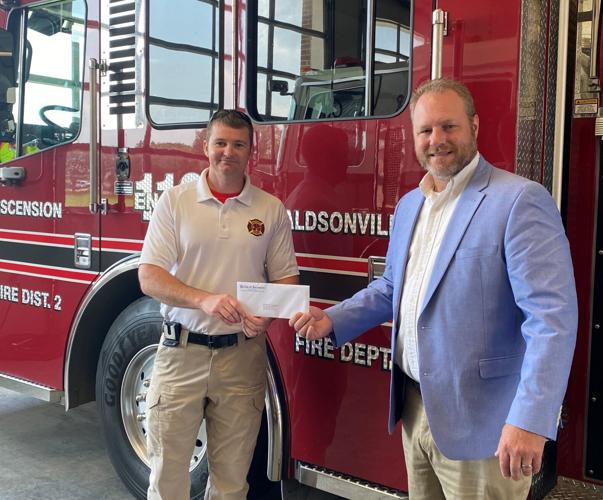 Ascension fire departments receive insurance rebate checks to fund fire