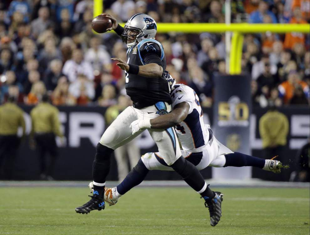 Denver Broncos tight end Owen Daniels and quarterback Peyton Manning  celebrate C.J. Anderson's two yard touchdown against the Carolina Panthers  in the fourth quarter of Super Bowl 50 in Santa Clara, California