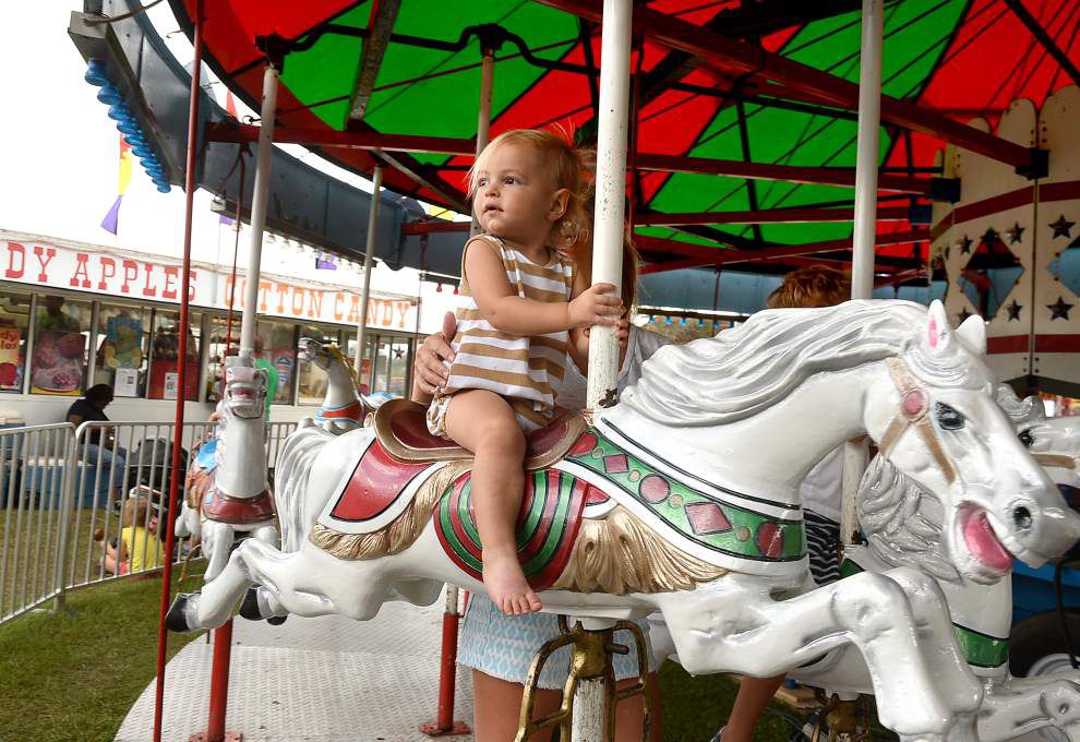 Flying horses, sliding dads, rolling dragons at St. George Fair _lowres