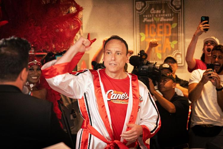 Joey Chestnut set a new record for eating Cane's chicken fingers. See, watch how many he ate