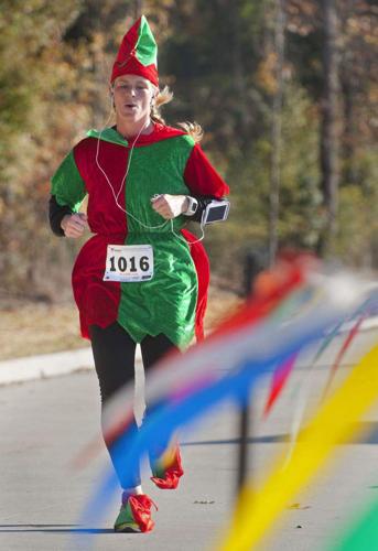 Santa’s ‘elves’ race through the streets of Central in festive 5K run ...