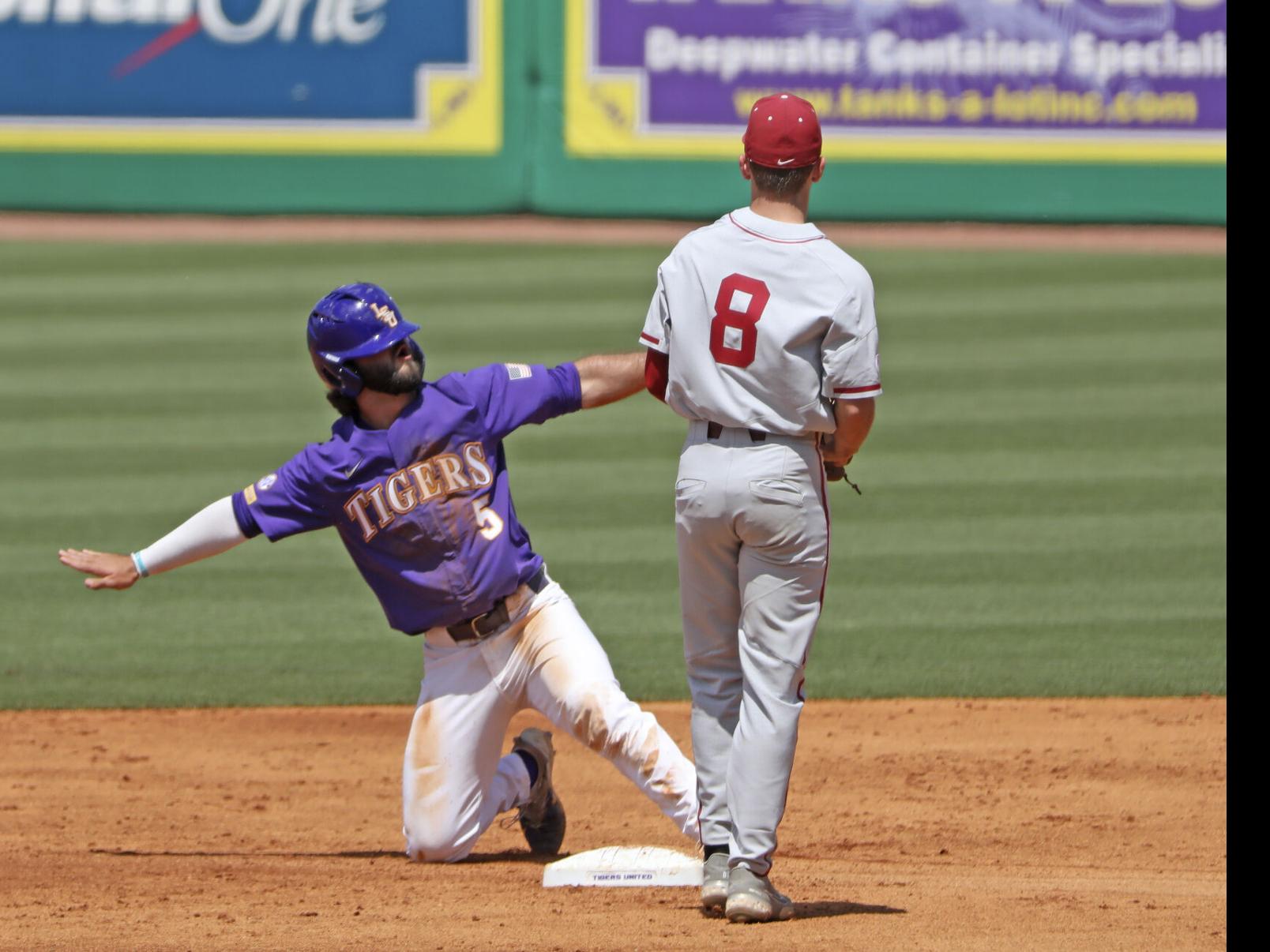 Alabama Peyton Wilson (8) runs to first during an NCAA baseball