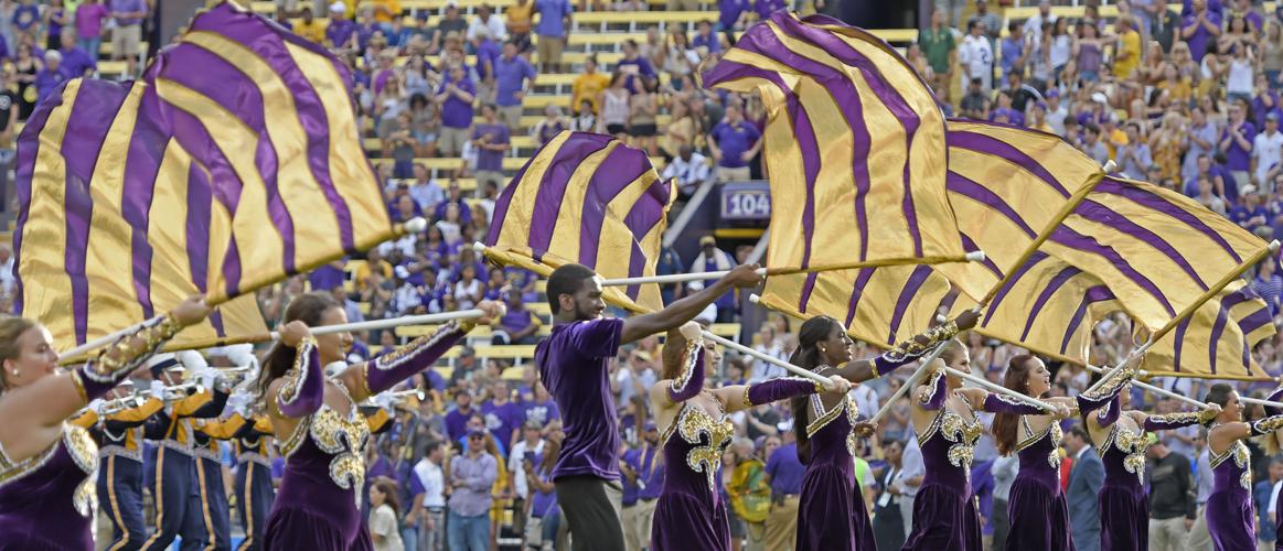 Believed to be first, City man dances, twirls flag with LSU