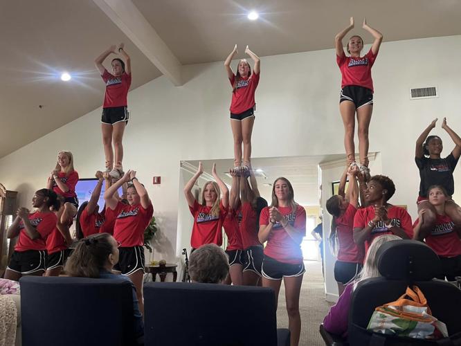 Zachary High cheerleaders perform at Oakwood Village Zachary