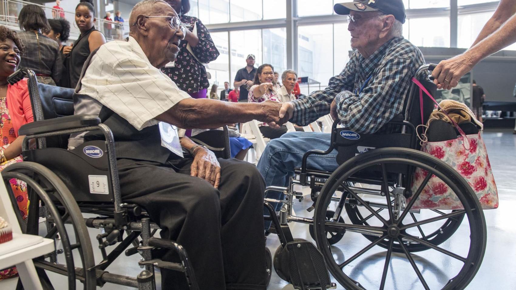 Photos: 110-year-old World War II veteran gets covered with kisses on his birthday at the WWII Museum